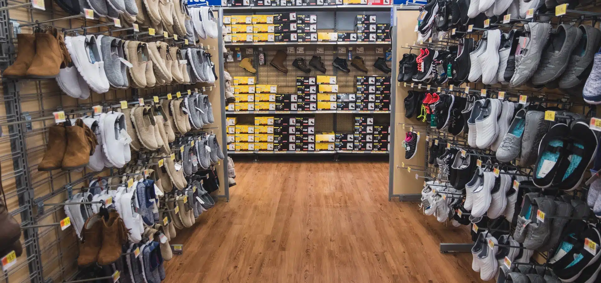 shoe-aisle-in-store-lots-of-shoes-on-racks-2023-11-27-05-11-56-utc